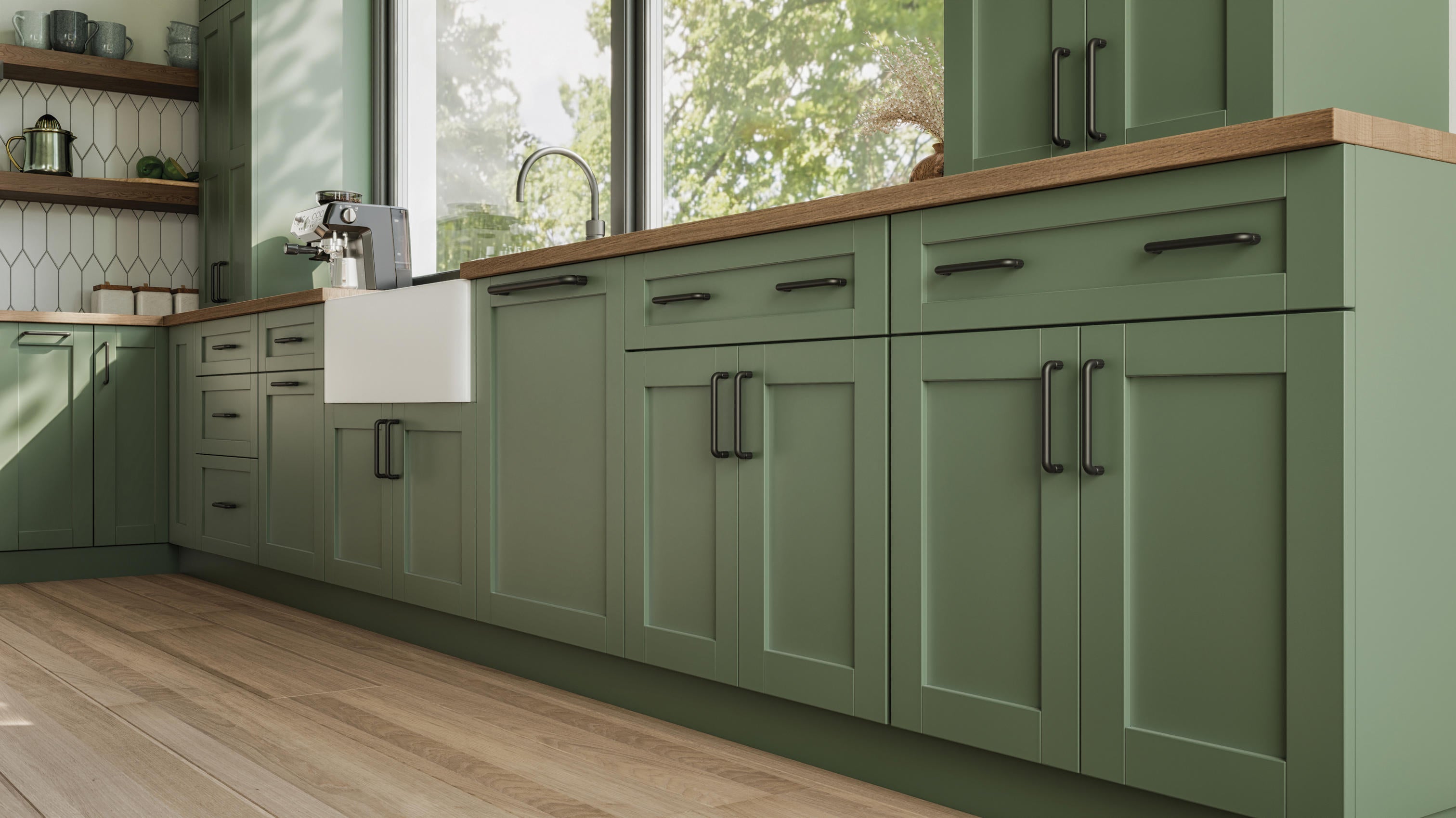 Atlas Homewares dark bronze pulls on sage green cabinetry