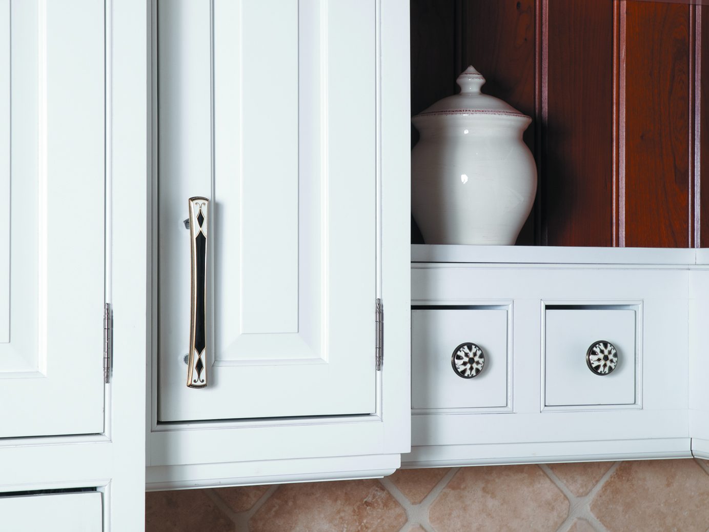Atlas Homewares Canterbury enameled pull and fleur knobs on white cabinetry