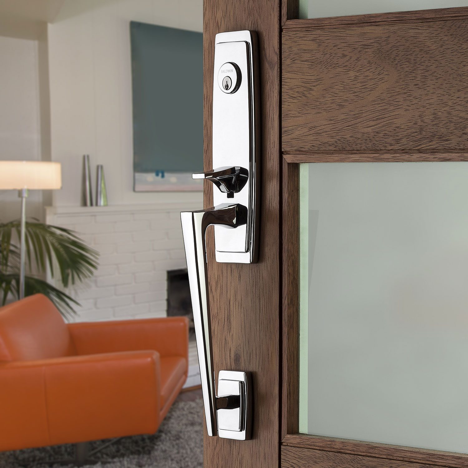 Baldwin chrome handleset installed on a wood front door