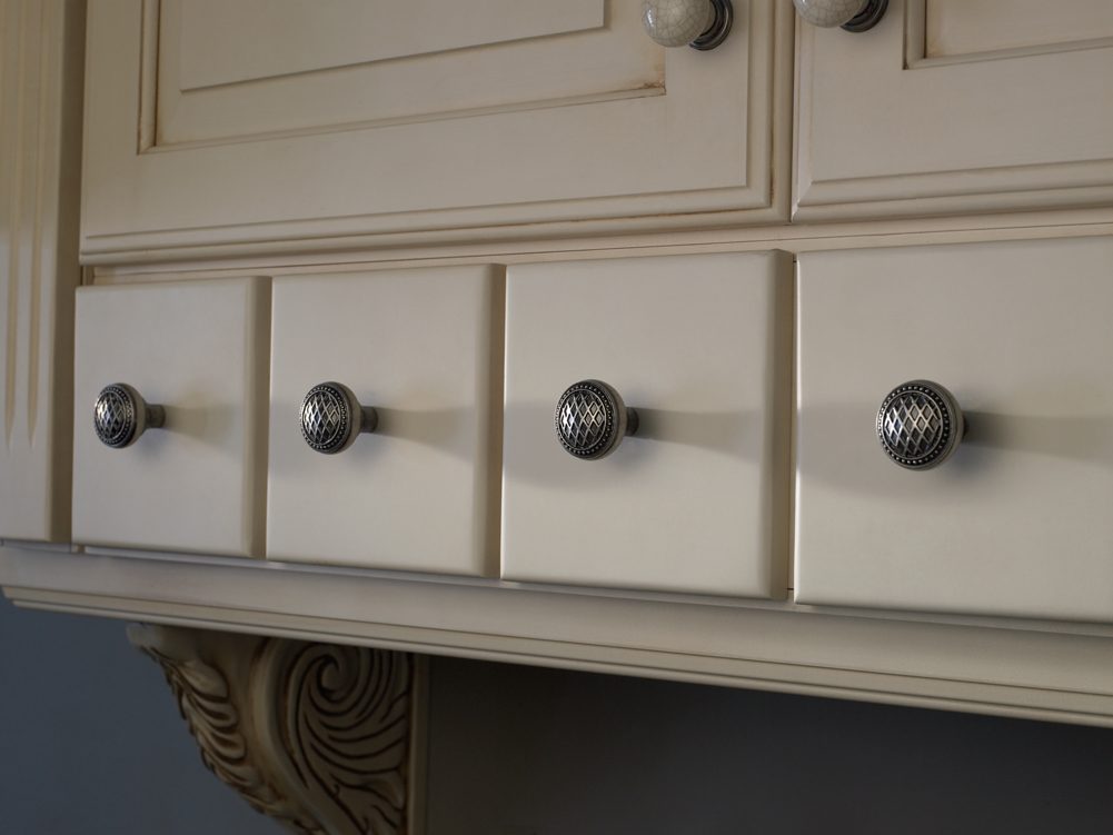 Top Knobs Trevi textured knobs on white drawers